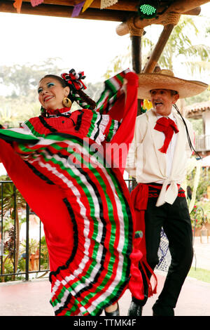 USA, California, San Diego, several members of Grupo Folklorico colorfully dance at the Fiesta de Reyes in Old Town Stock Photo