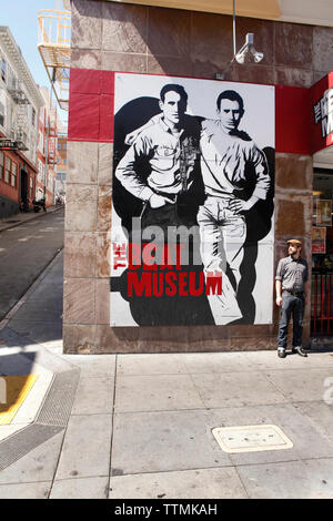 USA, California, San Francisco, Brandon Loberg stands in front of the Beat Museum and in North Beach, Broadway street Stock Photo