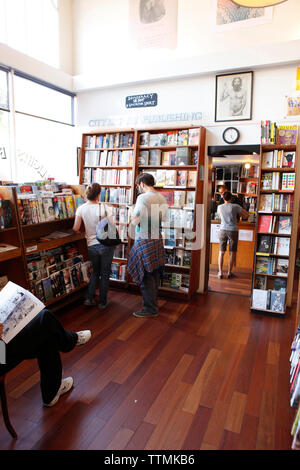 USA, California, San Francisco, browsing books at the City Lights Bookstore, North Beach Stock Photo