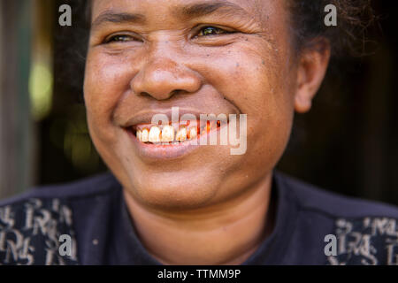 INDONESIA, Flores, Waturaka Village, a woman smiles and chews Beetle Nut Stock Photo