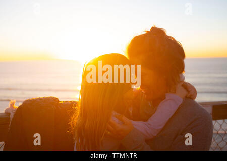 Mother and young daughter at sunset Stock Photo