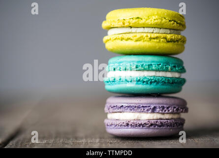 Close-up of colorful macaroons arranged on wooden table Stock Photo