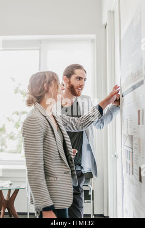 Colleagues discussing project in office Stock Photo