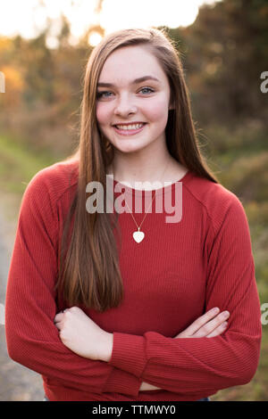 Happy, Confident, Camera Aware 18 Year Old Girl, at Sunset on Trail Stock Photo