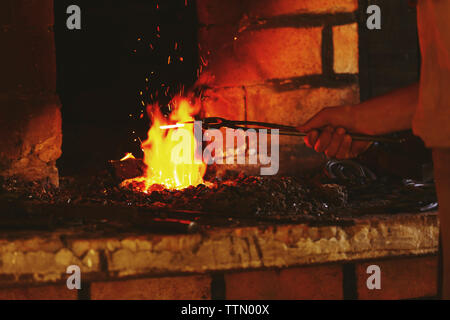 Fire in the furnace in the smithy Stock Photo