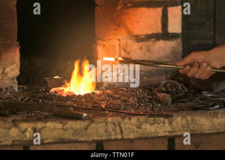Fire in the furnace in the smithy Stock Photo