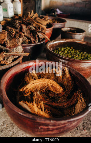Close-up of coconut shells in containers Stock Photo