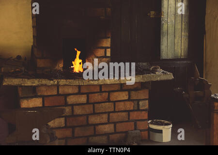 Fire in the furnace in the smithy Stock Photo