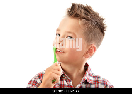 Cute boy with toothbrush isolated on white Stock Photo