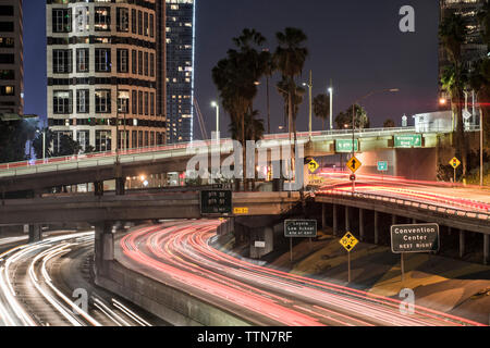 Light trails on elevated roads in city at night Stock Photo