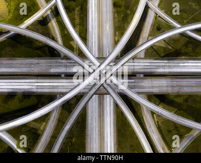 Aerial view of light trails on road intersections in city Stock Photo