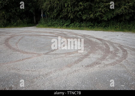 June 2016 - Skid tyre marks left in a gravel car park at Ham Wall RSPB Nature reserve Stock Photo