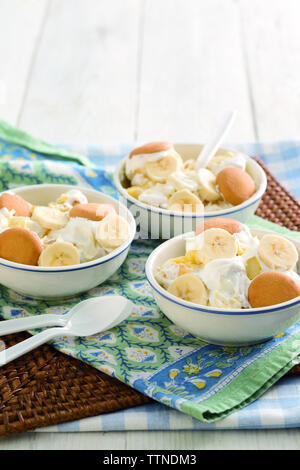 High angle view of banana pudding served in bowls on table at home Stock Photo