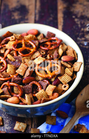 High angle view of Chex Mix served in bowl on table at home Stock Photo