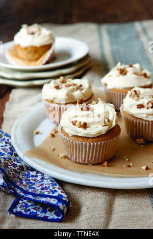 Close-up of cupcakes served in plate on table at home Stock Photo