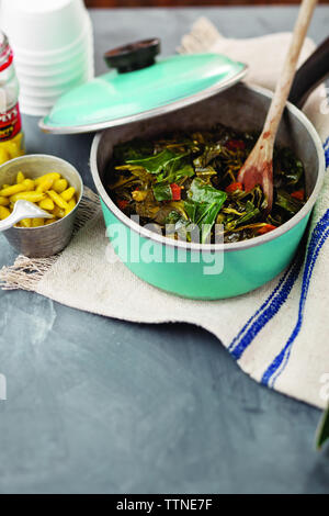 High angle view of leaf vegetables in stew pot on table at home Stock Photo