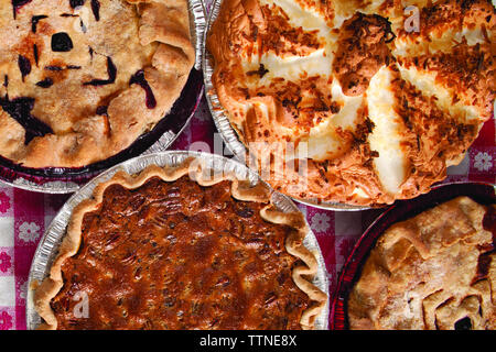 Overhead view of various sweet pies on table Stock Photo