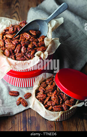 High angle view of pecans in containers on table at home Stock Photo