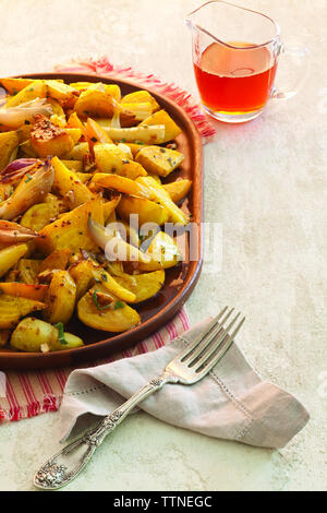 High angle view of roasted vegetables in plate on table Stock Photo