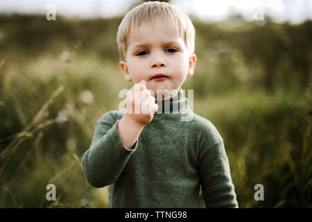 Portrait of a little pretty boy playing outside in the summertime Stock Photo