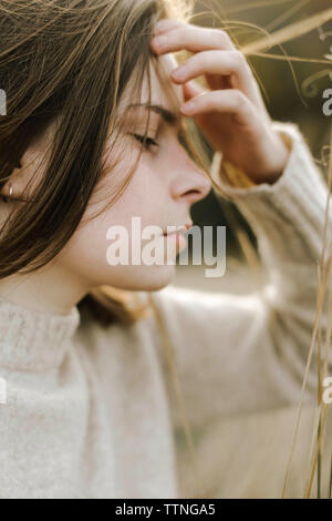 Beautiful portrait of a young stylish woman on a sunny day in autumn Stock Photo