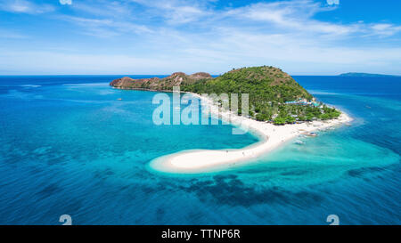 Scenic view of island amidst sea against sky Stock Photo