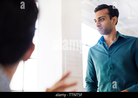 Low angle view of businessman in meeting at office Stock Photo