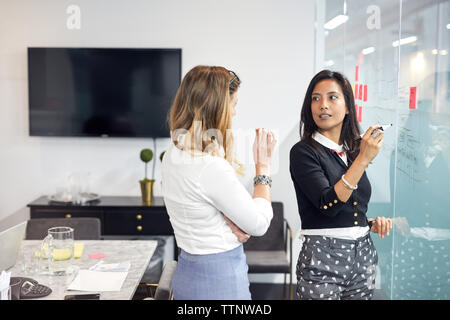 businesswomen having discussion during meeting in office Stock Photo