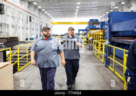 Manual workers working in metal Steel industry Factory Stock Photo