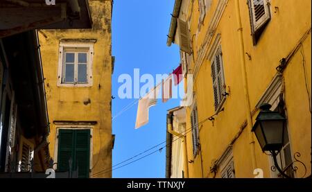 Corfu old town buildings,laundry hanging out to dry,on a washing line,suspended between buildings,Kerkyra,Greece,Greek islands,Ionian islands Stock Photo