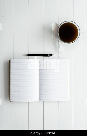 Open Notebook on Table Stock Photo