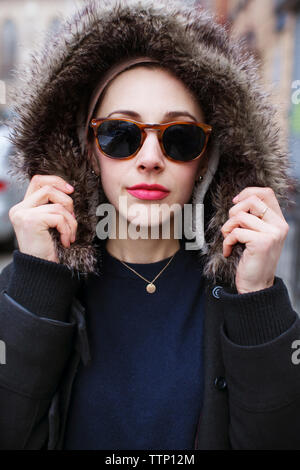 Close-up beautiful woman wearing hood Stock Photo