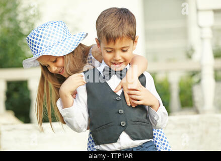 Small romantic kids on stairs Stock Photo