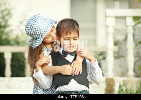 Small romantic kids on stairs Stock Photo