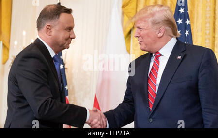 US PRESIDENT DONALD TRUMP at right greets Polish President Duda at the White House in  May 2019.  Photo: White House Stock Photo