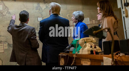 US PRESIDENT DONALD TRUMP visits the Second World War operations room in Whitehall with UK Prime Minister Theresa May. Melania Trmup at right. Photo: White House Stock Photo