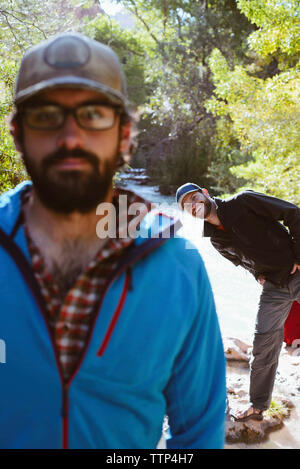 Portrait of happy brothers enjoying in forest Stock Photo