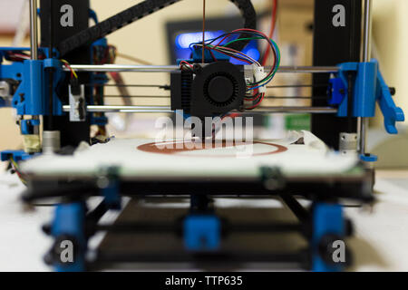 Close-up of 3D printer on table at office Stock Photo