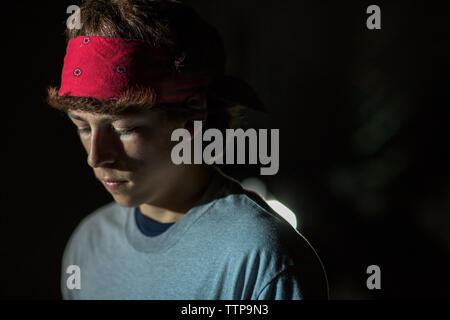 Close-up of young man looking down Stock Photo