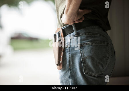 Midsection of farm worker wearing tool belt Stock Photo
