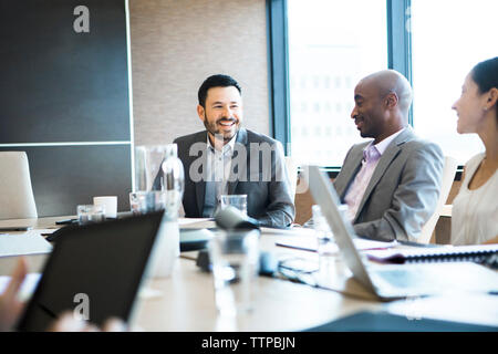 Colleagues planning in board room at office Stock Photo