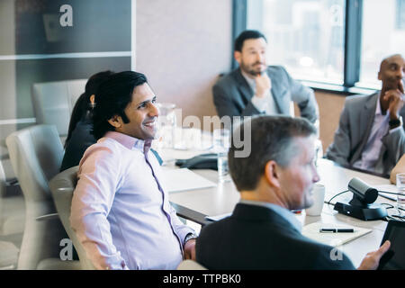 Colleagues discussing in board room at office Stock Photo
