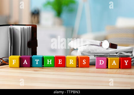 Wooden cubes on light background. Happy fathers day concept Stock Photo