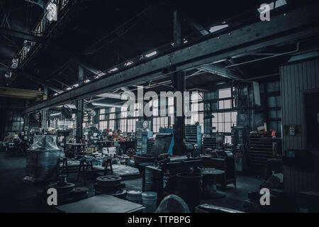 Distant view of workers working in metal industry Stock Photo