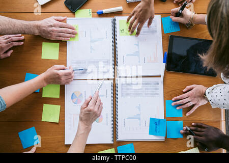 High angle cropped image of business people planning in board room Stock Photo