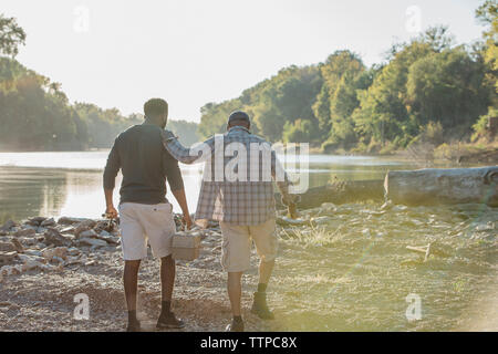 View of two fishing rods on stands with electronic lights on the background  of a beautiful green lake Stock Photo - Alamy