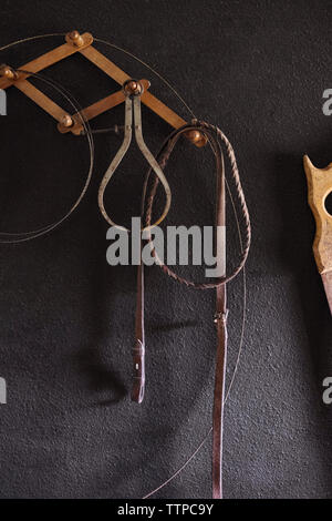 Work tools hanging on wall Stock Photo