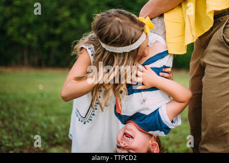 Happy family playing at backyard Stock Photo