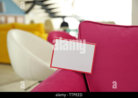 Pink armchair for sale in furniture store Stock Photo