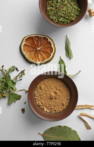 Flat lay of assorted herbs and spices on white background Stock Photo